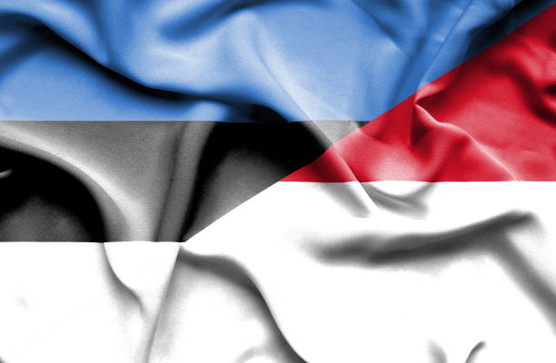 istock Waving flag of Monaco and Estonia 668724574