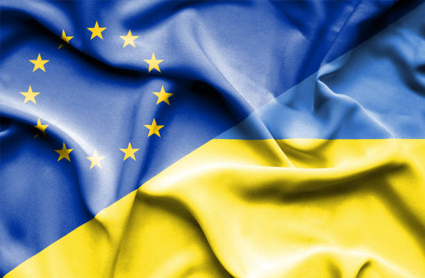 istock Waving flag of Ukraine and EU 668729636