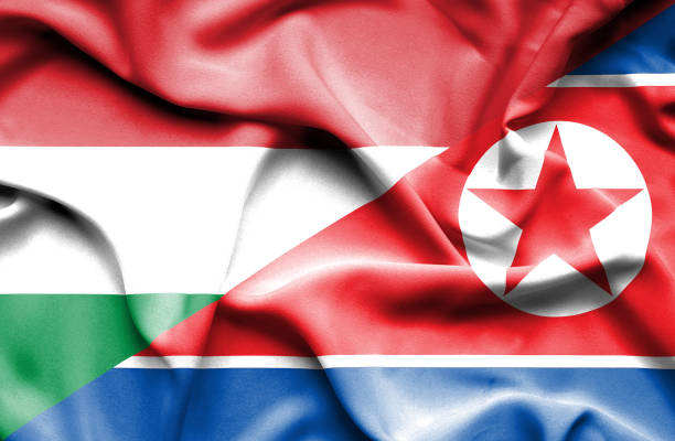 istock Waving flag of North Korea and Hungary 668736850