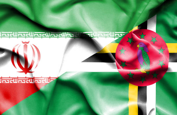 istock Waving flag of Dominica and Iran 668740928