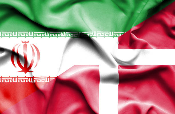 istock Waving flag of Denmark and Iran 668740938