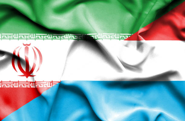 istock Waving flag of Luxembourg and Iran 668741100