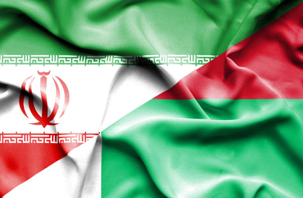 istock Waving flag of Madagascar and Iran 668741106