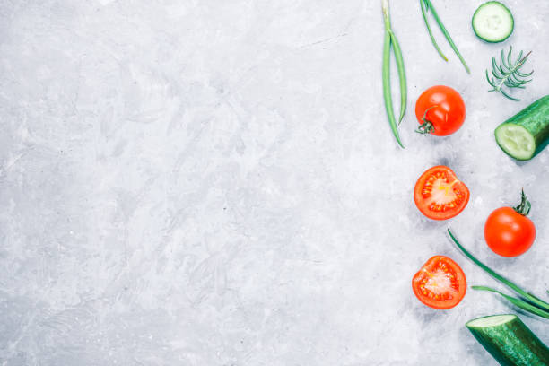 istock Fresh cucumber and tomato on concrete 668741290