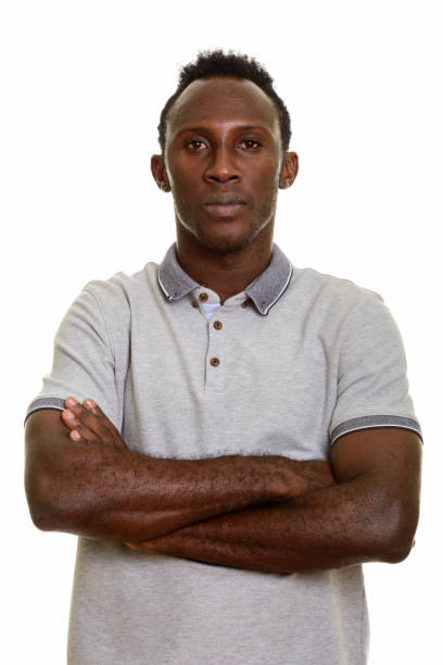 istock Young black African man with arms crossed 668743844