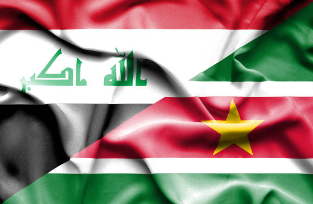 istock Waving flag of Suriname and Iraq 668743846