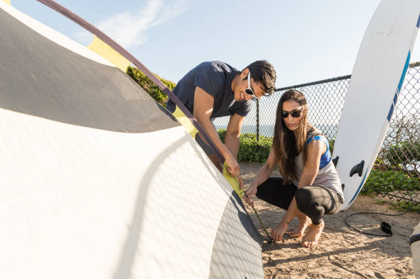 istock Couple Setting Up A Tent In A Campground. 668757506