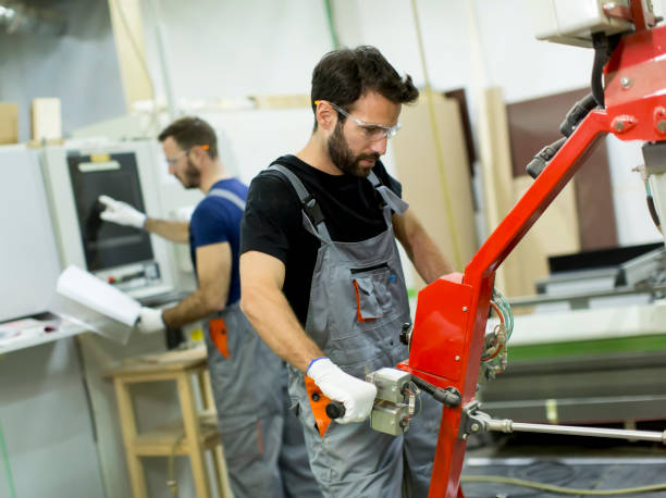 istock Young men working in factory 668757844