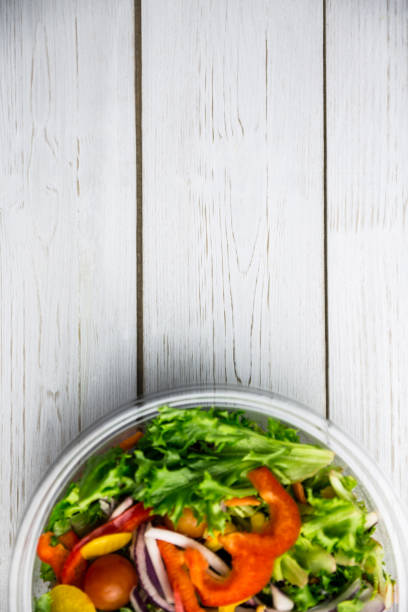 istock Healthy bowl of salad on table 668764016