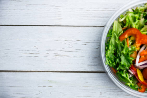 istock Healthy bowl of salad on table 668764018