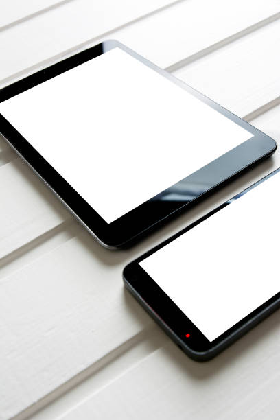 istock mpty generic tablet pc and mobile on top of white wood 668767430