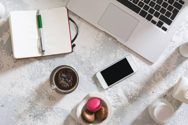 istock Desktop office mix on a wooden table 668767610