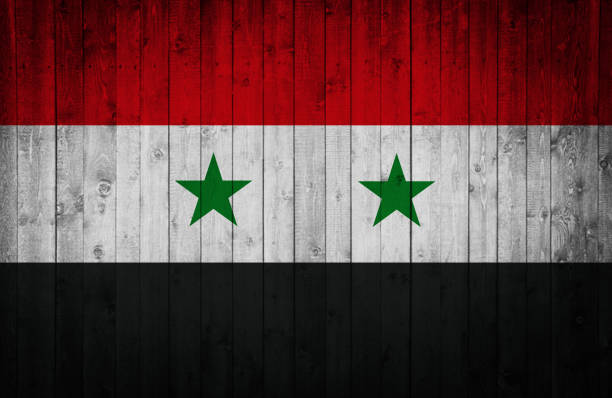 istock Syrian flag is painted on a wooden surface 668769880