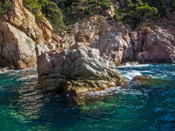 istock The sea splashing on the rocks 668774388