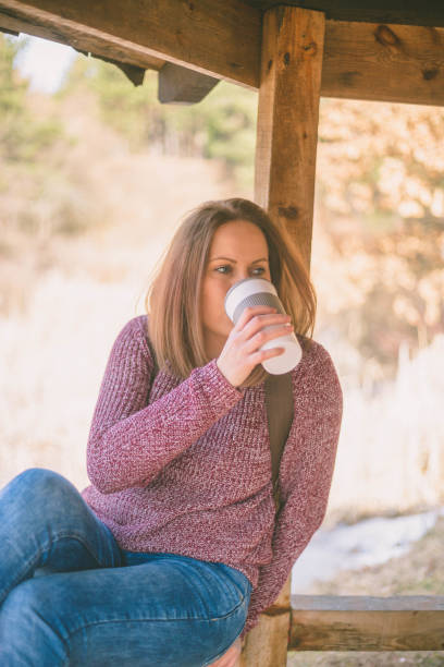 istock Beautiful Young Woman sitting 668779886