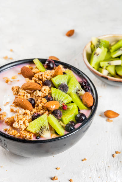 istock Smoothie bowl with fruits and nuts 668792358