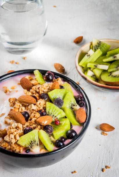 istock Smoothie bowl with fruits and nuts 668792390