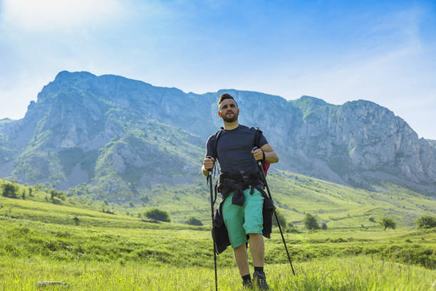 istock Man with Nordic Sticks Hiking 668793406