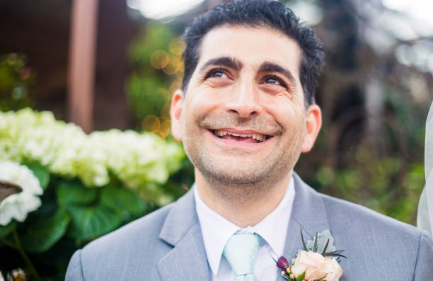 istock Attractive diverse groom looking up and thinking 668795882