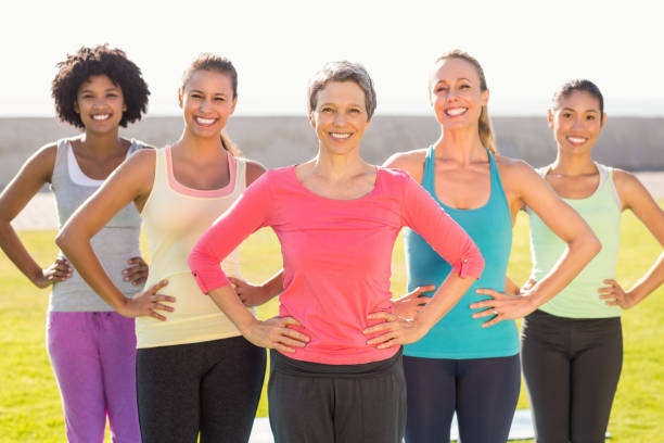 istock Smiling sporty women with hands on hips 668807918
