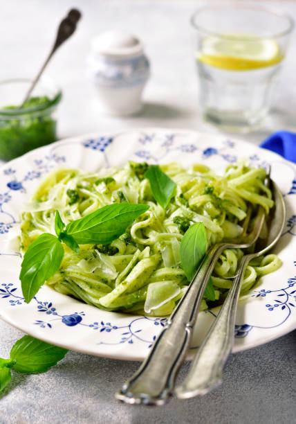 istock Pasta with green sauce pesto 668808358