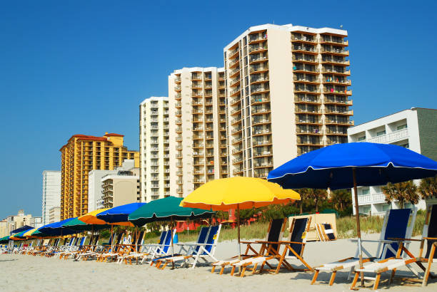 istock Beach umbrellas and chairs are quite inviting 668817654