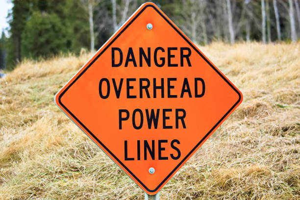 istock Closeup of a danger overhead power line sign 668817748