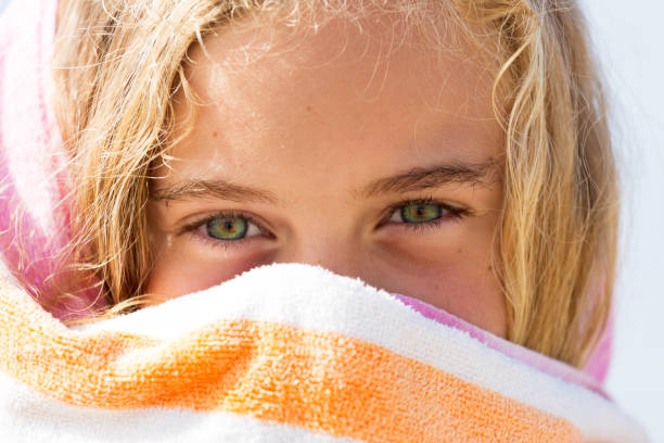 Cheeky Young Girl Wrapped In Towel stock photo