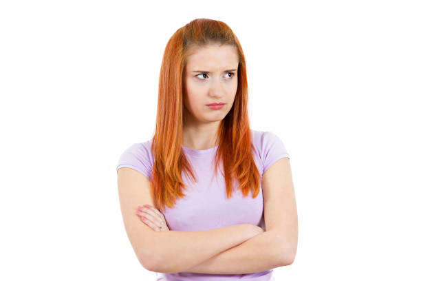 istock angry, mad, annoyed, grumpy, jealous young woman, looking unhappy 668829396
