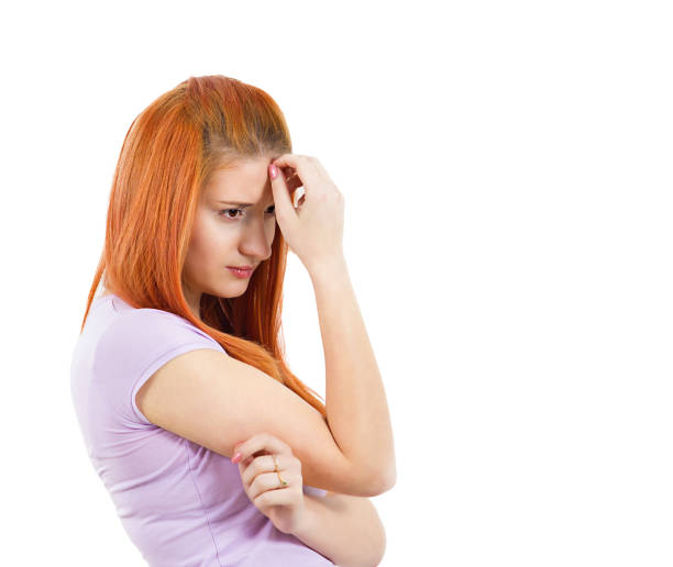 istock young upset woman thinking deeply about something hand on head 668831508