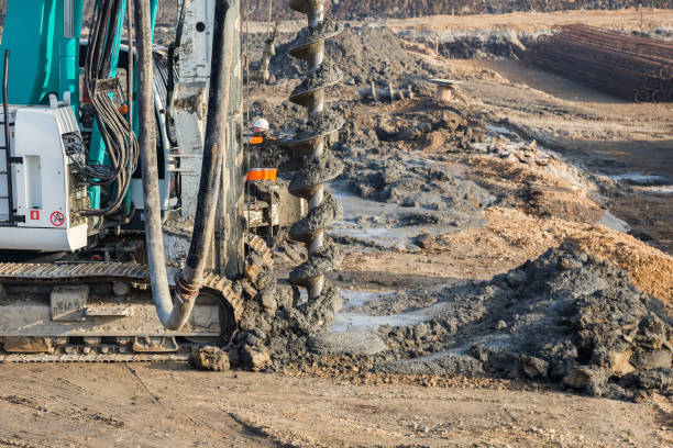 istock Drilling tractor installs concrete piles 668838412