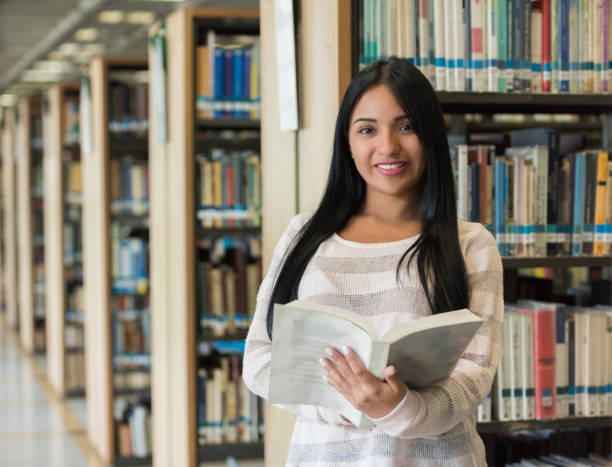 istock Portrait of a feamel student at a library 668843394