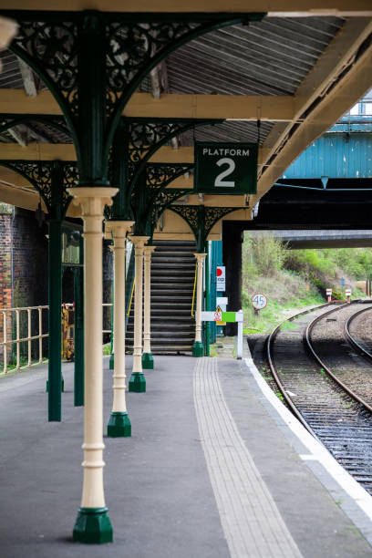 istock retro styled Victorian era railway platform in Kent England 668843822