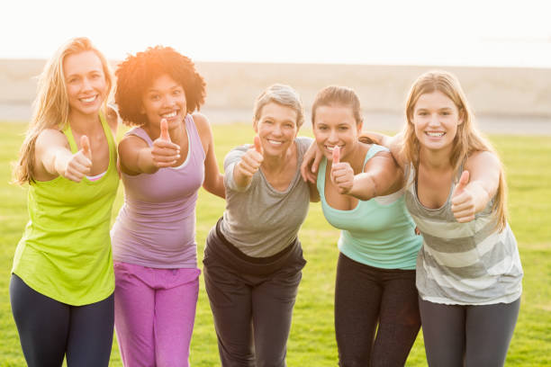 istock Smiling sporty women doing thumbs up 668861306