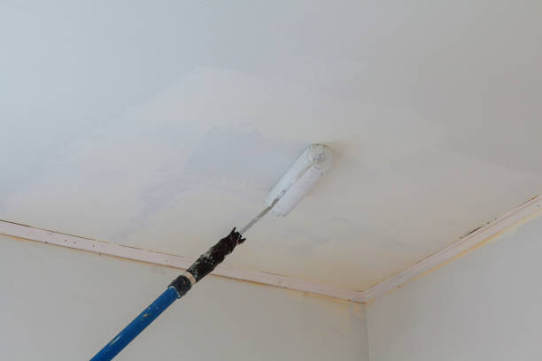 istock Close up Of Professional Workman Hand holding Dirty Paint roller 668870302