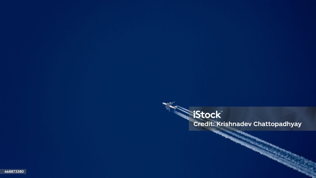 Aeroplane Flying Plane is flying on a blue sky Privacy Stock Photo