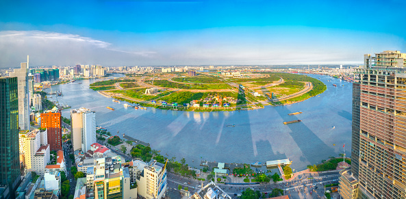 Ho Chi Minh City, Vietnam - April 11, 2017:Panorama High view Saigon skyline when the sun shines down urban with tall buildings along river showing development of country in Ho Chi Minh City, Vietnam