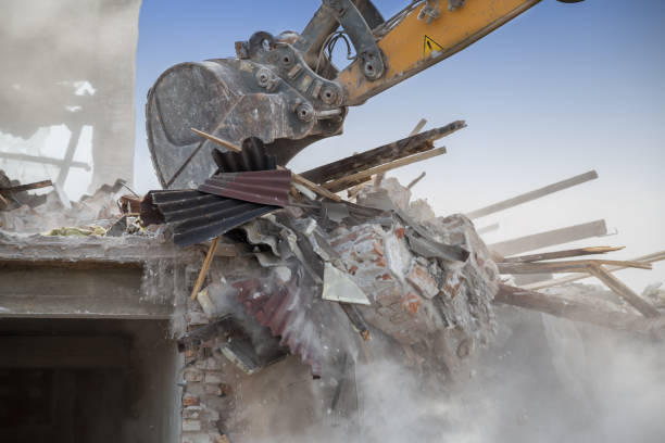 istock Backhoe demolishing house 2 668874266