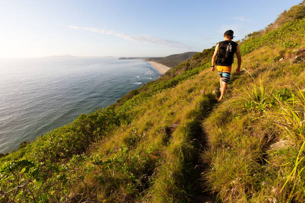 istock A Hiker on a Trail Looks Over a Coastal View 668878046