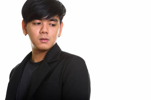 istock Studio shot of cool handsome Asian man thinking while looking sad 668885186