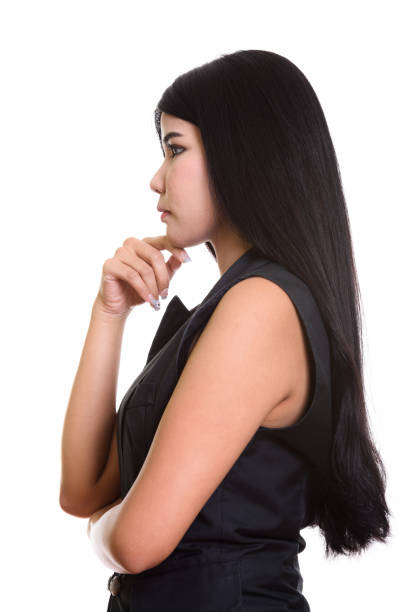istock Profile view of young Asian woman thinking 668889242
