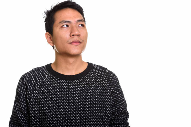 istock Studio shot of young Asian man thinking 668894382
