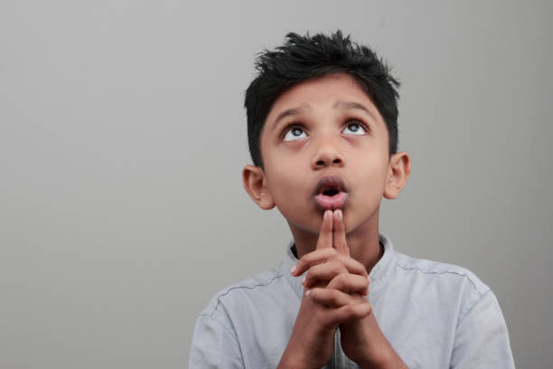 istock Portrait of a boy looks up and thinks 668894810