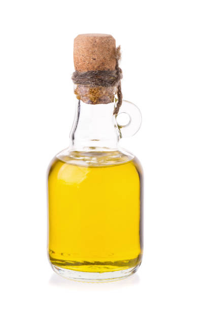 istock oil and soybean close up on white background 668895364
