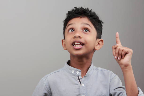 istock Portrait of a boy with an expression when he gets an idea or solution 668895914