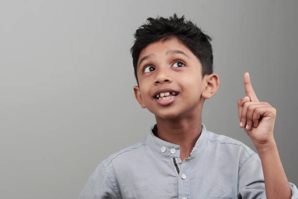istock Portrait of a boy with an expression when he gets an idea or solution 668898648