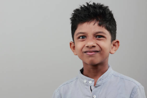 istock Portrait of a boy with a cheering face 668898844