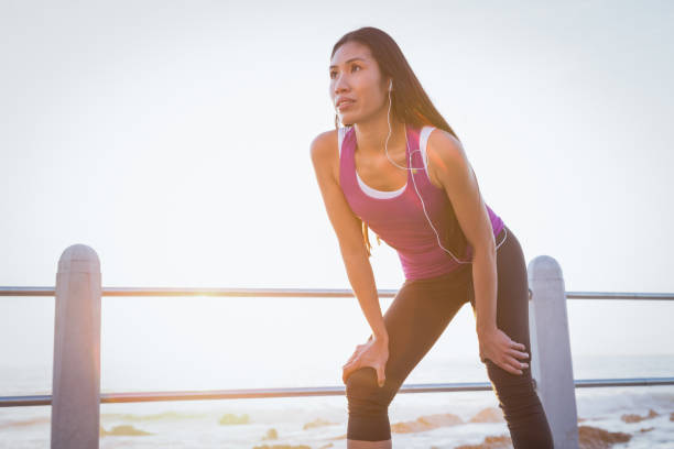 istock Fit woman resting at promenade 668903022