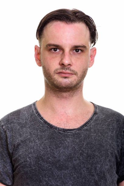 istock Face of young man against white background 668905148