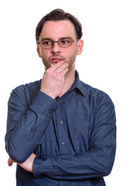 istock Studio shot of young businessman thinking while wearing eyeglasses 668905480